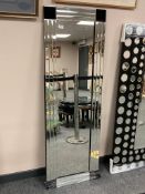 An all glass rectangular mirror,