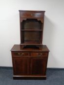A regency style double door cabinet fitted two drawers together with matching bookshelves fitted a