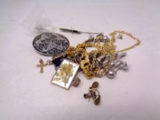 A collection of costume jewellery pendants,