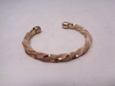 A heavy gold plated bangle