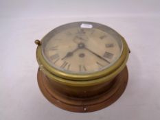A circular brass ship's clock