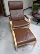 A beech framed brown leather armchair with matching footstool