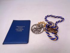 A Decimal coin set in wallet together with costume necklace, large pendant etc.