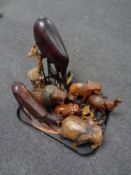 A tray containing a quantity of carved wooden tourist animal figures