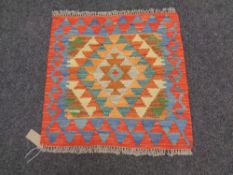 A Choli kilim, 53cm by 54cm.