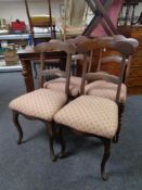 A set of four antique dining chairs on cabriole legs