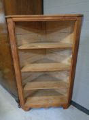 An antique pine corner cupboard (no door)