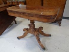 A 19th century mahogany turnover top pedestal tea table