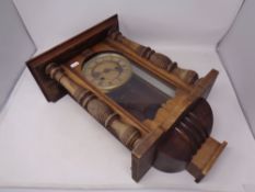 A mahogany eight day wall clock