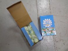 A box containing a quantity of Christmas splat snowballs