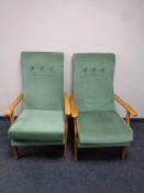 A pair of beech framed fireside chairs in green dralon and a lamp table