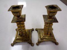 A pair of Victorian brass candlesticks