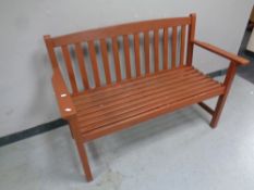 A stained wooden garden bench,