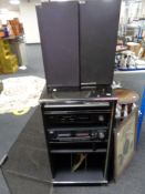 A Hitachi hi/fi system with speakers in cabinet