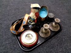 A tray of tooled leather belt and buckle, circular barometer, pair of plated candlesticks,