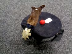 A Scottish Highlanders beret with badge and plume