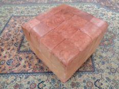 A 20th century leather foot cube