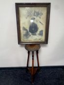 An Edwardian plant stand on tripod legs and an antiquarian print 