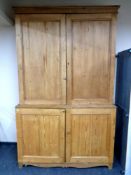 A Victorian stripped pine housekeeper's cupboard CONDITION REPORT: 156cm wide by