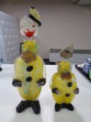 Two graduated Murano glass clown decanters,