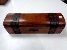 A domed topped jewellery box with metal mounts