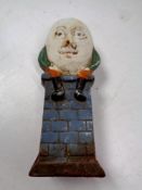 A cast iron novelty Humpty Dumpty money box