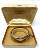 A 9ct gold bangle, weight 26.