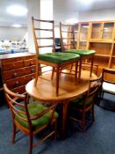 A 20th century Mcintosh Furniture oval extending dining table, fitted internal leaf,