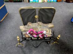 A brass framed three-way folding spark guard and a log effect electric fire