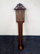 A 19th century stick barometer.