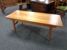 A 20th century teak extending coffee table