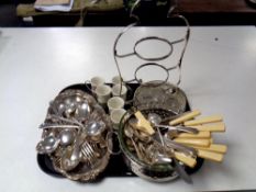 A tray of assorted plated wares and a large quantity of plated cutlery,