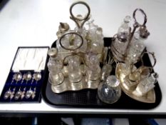 A tray of antique plated and cut glass cruet sets, perfume bottle,