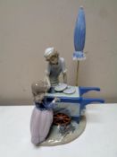 A Lladro figure group : Ice cream vendor,