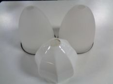 A pair of early 20th century opaque glass shades together with a further light shade.