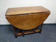A 20th century oak gate leg table