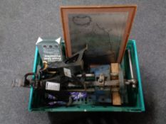 A crate of car jacks, car seat protectors, vintage bench vice,