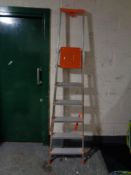 A pair of six tread folding aluminium ladders