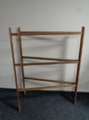 An antique pine folding towel rail