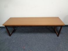A 20th century refectory coffee table on teak legs