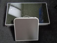 Two folding portable camping tables