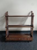 A fret work three tier wall shelf fitted drawers