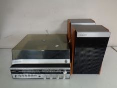 A vintage Fidelity solid state stereo system with speakers and a box of vinyl 78's,