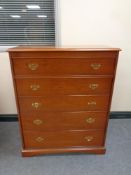 A Stag five drawer chest in a teak finish