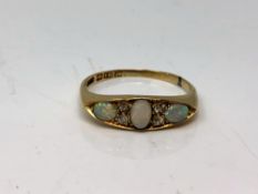 An antique 18ct gold opal and diamond ring, size Q. CONDITION REPORT: 3.