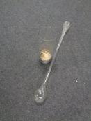 A glass yard of ale together with a glass vase