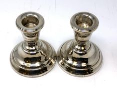 A pair of silver dwarf candlesticks, height 8cm.