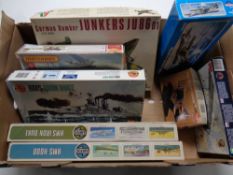 A box containing eight plastic modelling kits to include Airfix and Matchbox naval boats and