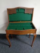An Edwardian oak cutlery table
