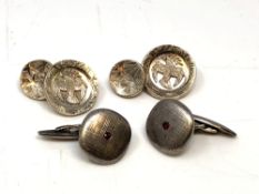 Two pairs of silver cuff links.